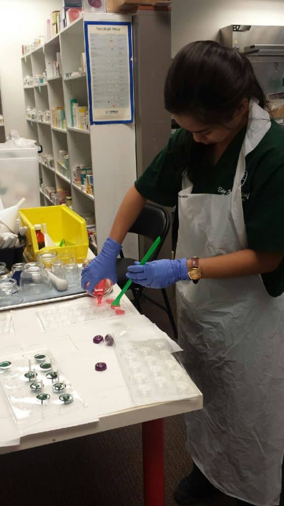 A Medical student works hard to delight the customers on her Pharmacy Tech Program Externship