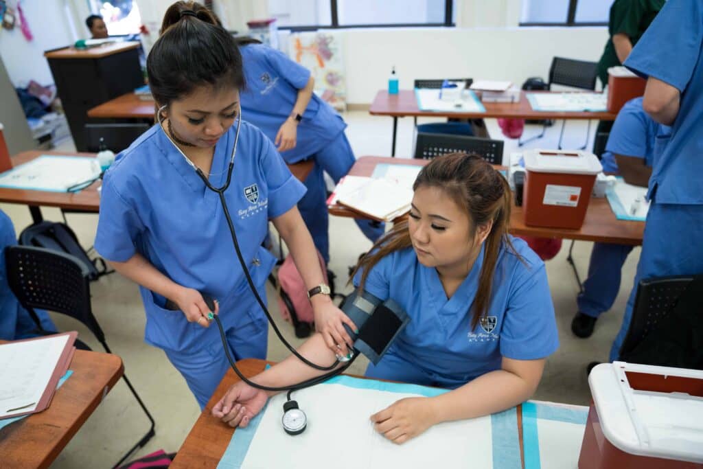 Picture of a Certified Medical Assistant performing her Clinical duties.