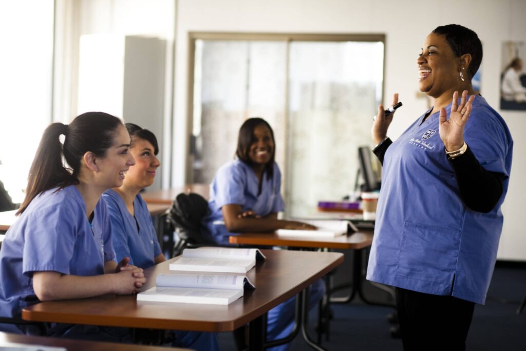 Medical students are being coached by a professional as part of their Medical Assistant Program training in the bay Area.