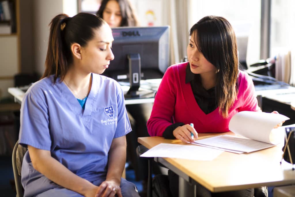 A Student preparing their first Phlebotomist resume and having it reviewed by a Career services staff.