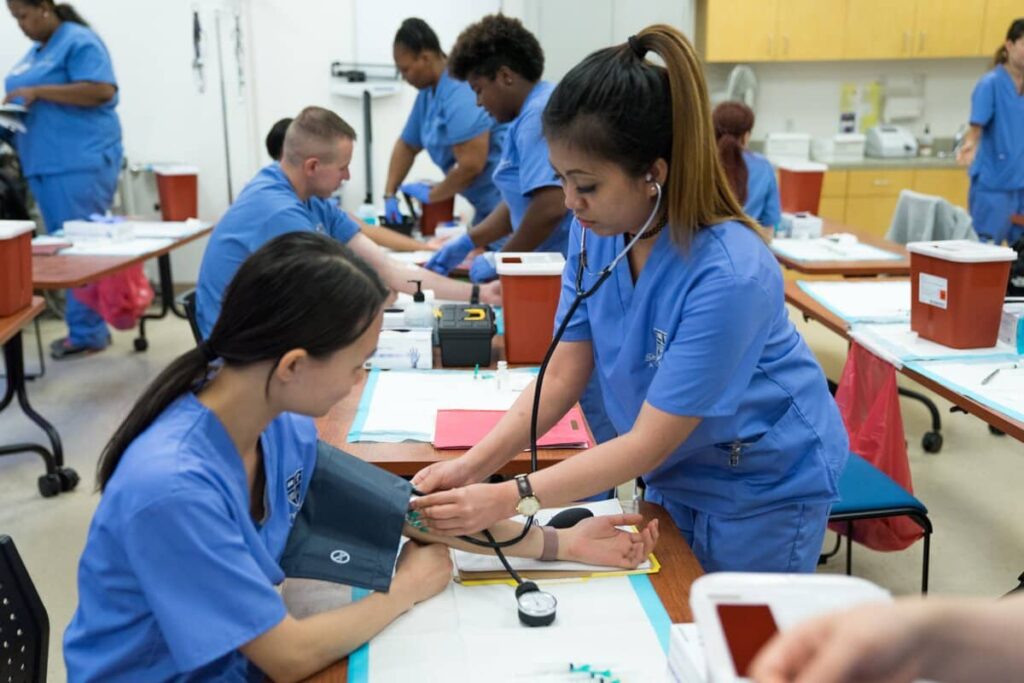 Students in training for medical assisting careers at Bay Area Medical Academy.