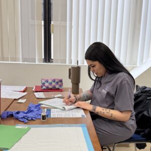 A student studying in medical assistant training 