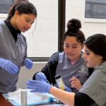 bay area medical academy students in medical assistant training 